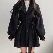 Women's trench coat with belt and puff sleeves