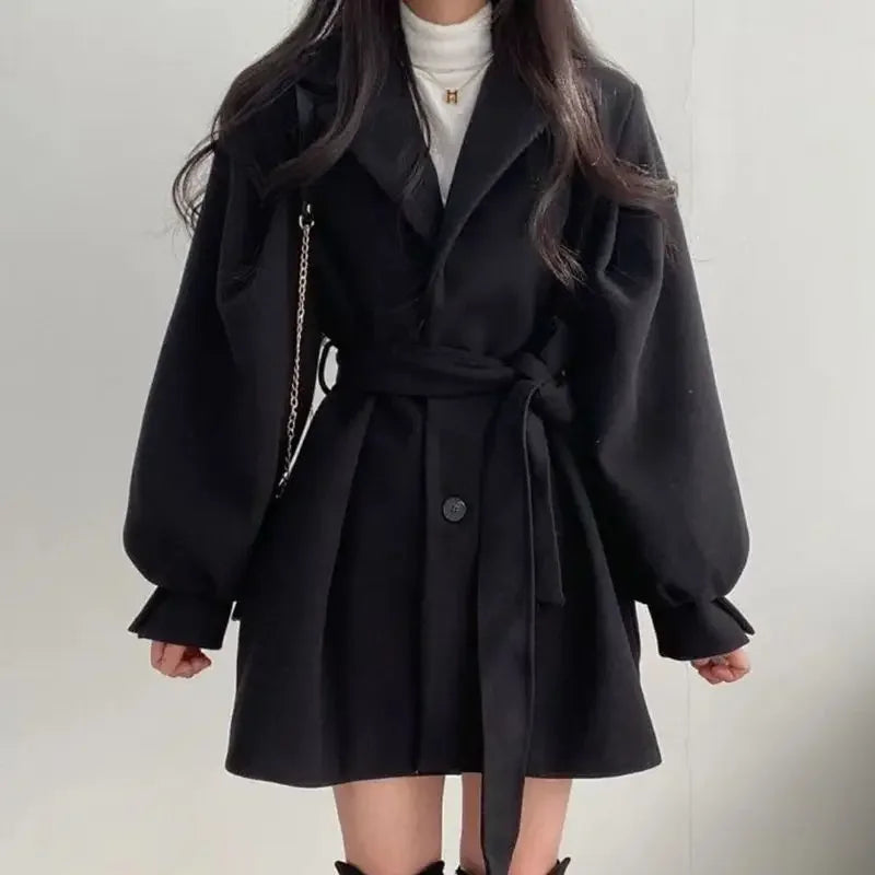 Women's trench coat with belt and puff sleeves