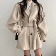 Women's trench coat with belt and puff sleeves