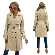 Women's trench coat with double-breasted button closure and tailored belt